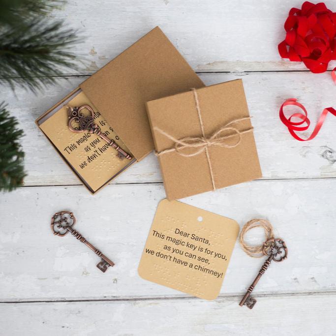 Santa keys with braille labels and a gift box. 