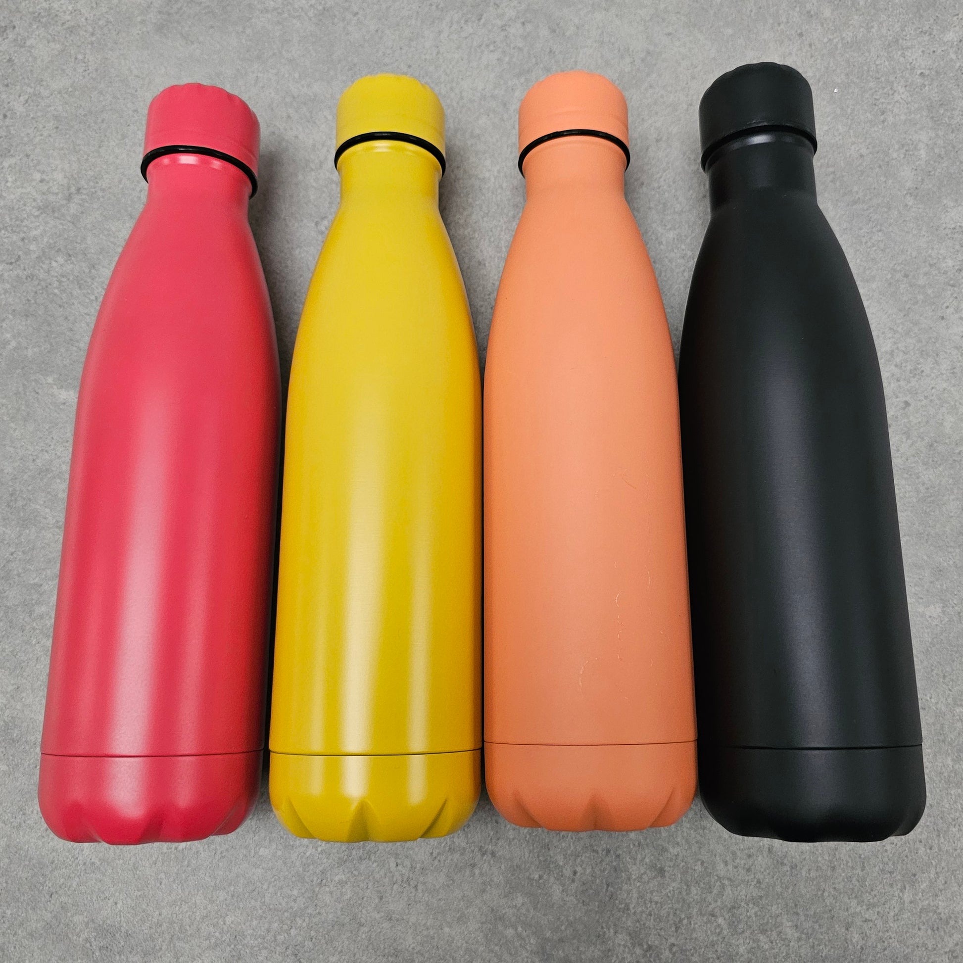 Red, yellow, orange and black water bottles.